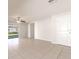 Living room with tile floors, sliding doors and ceiling fan at 207 Goldenrod Ln, Kissimmee, FL 34759