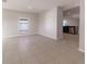 Bright and spacious living room with tile floors at 207 Goldenrod Ln, Kissimmee, FL 34759