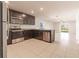 Modern kitchen with stainless steel appliances and granite countertops at 207 Goldenrod Ln, Kissimmee, FL 34759