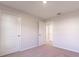 Spacious bedroom with carpet and double door closet at 207 Goldenrod Ln, Kissimmee, FL 34759
