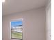 Simple bedroom with a window and neutral walls at 207 Goldenrod Ln, Kissimmee, FL 34759