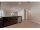 Open kitchen with granite countertops and stainless steel appliances at 207 Goldenrod Ln, Kissimmee, FL 34759