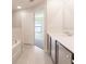 Bathroom with double vanity and access to bedroom and tub at 207 Goldenrod Ln, Kissimmee, FL 34759