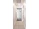 Bright hallway with tile flooring leading to bedrooms at 207 Goldenrod Ln, Kissimmee, FL 34759