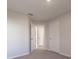 Bedroom with carpet, neutral walls and two closets at 207 Goldenrod Ln, Kissimmee, FL 34759