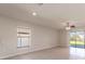 Living area with tile floors, ceiling fan and sliding doors at 207 Goldenrod Ln, Kissimmee, FL 34759
