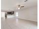 Open concept living area with kitchen view and ceiling fan at 207 Goldenrod Ln, Kissimmee, FL 34759