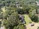 Aerial view showcases the home's setting amongst lush greenery at 7129 Oakwind Dr, Orlando, FL 32818