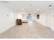 Spacious main bedroom with tile floors and large TV at 7129 Oakwind Dr, Orlando, FL 32818