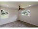 Bright bedroom with tile floors and a ceiling fan at 7129 Oakwind Dr, Orlando, FL 32818