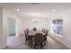 Formal dining room with chandelier and large windows at 7129 Oakwind Dr, Orlando, FL 32818
