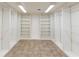Spacious walk-in closet with ample shelving and hanging rods at 7129 Oakwind Dr, Orlando, FL 32818