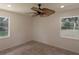 Simple bedroom with tile floors and ceiling fan at 7129 Oakwind Dr, Orlando, FL 32818