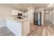 Modern kitchen with white cabinets and stainless steel appliances at 231 Begonia Ln, Kissimmee, FL 34759