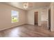 Well-lit bedroom with vinyl flooring and a large window at 231 Begonia Ln, Kissimmee, FL 34759