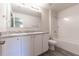 Bathroom boasts double vanity, a bathtub, and vinyl flooring at 231 Begonia Ln, Kissimmee, FL 34759