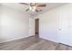 Spacious bedroom featuring ceiling fan and laminate flooring at 231 Begonia Ln, Kissimmee, FL 34759