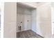 Laundry closet with vinyl flooring and shelving at 231 Begonia Ln, Kissimmee, FL 34759