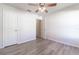 Bright bedroom with ceiling fan and laminate flooring at 231 Begonia Ln, Kissimmee, FL 34759