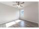 Well-lit bedroom with ceiling fan and laminate floors at 231 Begonia Ln, Kissimmee, FL 34759