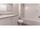 Clean bathroom with a single vanity, shower/tub combo and vinyl flooring at 231 Begonia Ln, Kissimmee, FL 34759