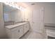 Double vanity bathroom with modern fixtures and gray tile at 11807 Fiction Ave, Orlando, FL 32832