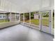 Spacious screened porch overlooking the backyard at 908 Perkins St, Leesburg, FL 34748