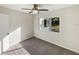 Spacious bedroom with ceiling fan and ample natural light at 908 Perkins St, Leesburg, FL 34748