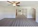 Open living room with view into dining area at 908 Perkins St, Leesburg, FL 34748