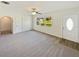 Spacious living room with carpet and large windows at 908 Perkins St, Leesburg, FL 34748