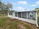Newly renovated home with screened porch and backyard at 908 Perkins St, Leesburg, FL 34748