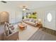 Living room with neutral decor and large windows at 908 Perkins St, Leesburg, FL 34748