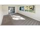 Sunlit Gathering room with sliding doors leading to patio at 908 Perkins St, Leesburg, FL 34748