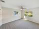 Bright bedroom with new carpet and large windows at 908 Perkins St, Leesburg, FL 34748