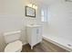 Clean bathroom with new vanity and shower at 908 Perkins St, Leesburg, FL 34748