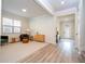 Light and airy living room with hardwood floors and seating area at 5653 Oak Knoll Dr, St Cloud, FL 34771