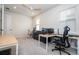 Home office featuring two desks, seating and large window at 5653 Oak Knoll Dr, St Cloud, FL 34771