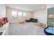 Spacious upstairs playroom with toys, a couch, and large windows at 5653 Oak Knoll Dr, St Cloud, FL 34771