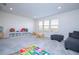 Bright playroom with toys, a couch, and plenty of natural light at 5653 Oak Knoll Dr, St Cloud, FL 34771