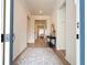 Bright entryway with hardwood floors and modern console table at 5653 Oak Knoll Dr, St Cloud, FL 34771