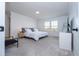 Spacious bedroom with large windows, plush carpet, and ample closet space at 5653 Oak Knoll Dr, St Cloud, FL 34771