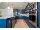 Sleek kitchen with stainless steel appliances and a large island at 5653 Oak Knoll Dr, St Cloud, FL 34771