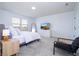 Bright bedroom featuring a comfortable bed and plenty of natural light at 5653 Oak Knoll Dr, St Cloud, FL 34771