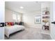 Cozy bedroom with a bed, desk, and wall-mounted storage at 5653 Oak Knoll Dr, St Cloud, FL 34771