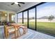 Covered patio with sliding glass doors and view of backyard at 5653 Oak Knoll Dr, St Cloud, FL 34771