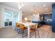 Bright kitchen with an island, stainless steel appliances, and dining area at 5653 Oak Knoll Dr, St Cloud, FL 34771
