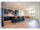 Open concept kitchen with island seating, stainless steel appliances, and dining area at 5653 Oak Knoll Dr, St Cloud, FL 34771
