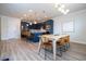 Kitchen and dining area with an open floor plan and light wood table at 5653 Oak Knoll Dr, St Cloud, FL 34771