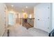 Upstairs hallway with carpet, doors to bedrooms, and staircase at 5653 Oak Knoll Dr, St Cloud, FL 34771