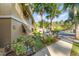 Landscaped walkway near condo building at 120 Hibiscus Woods Ct # 8D, Deltona, FL 32725